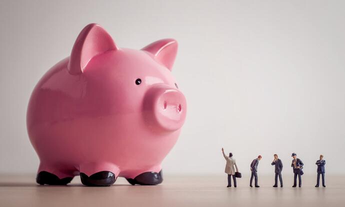 Payroll outcourcing: The picture shows an oversized, pink piggy bank.