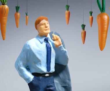 Interim managers surrounded by benefits, presented as carrots.