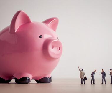 Payroll outcourcing: The picture shows an oversized, pink piggy bank.