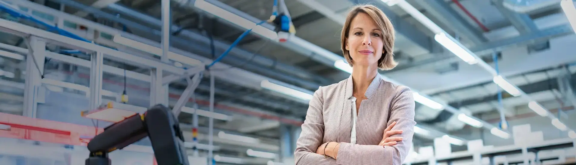 The picture shows an Interim Operations Manager on a factory floor.