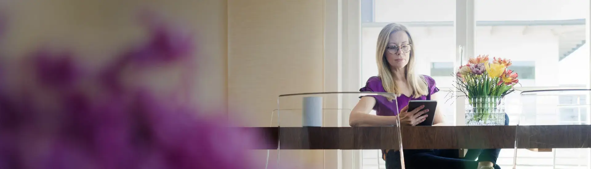 Head of Controlling: The picture shows a Head of Controlling looking at a tablet.