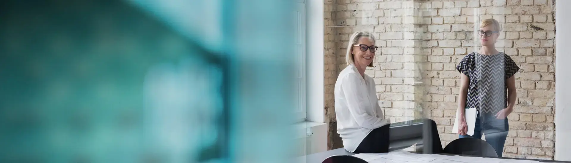 Head of Accounting: The picture shows a Head of Accounting in a modern working environment.
