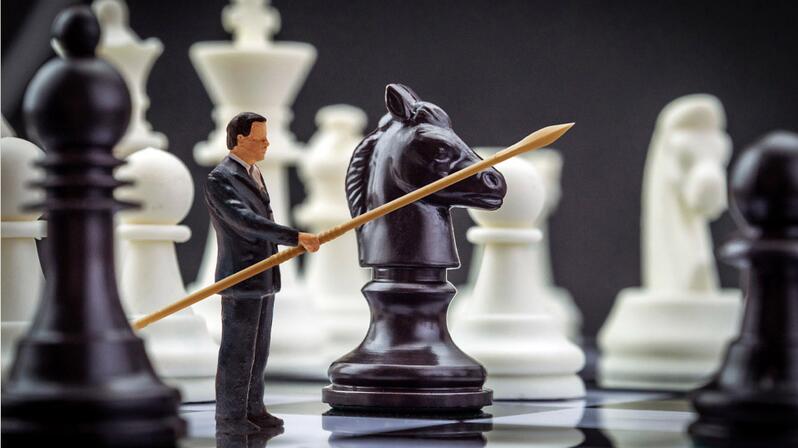 The graphic shows a Freelancer figure with a lance on a chessboard.