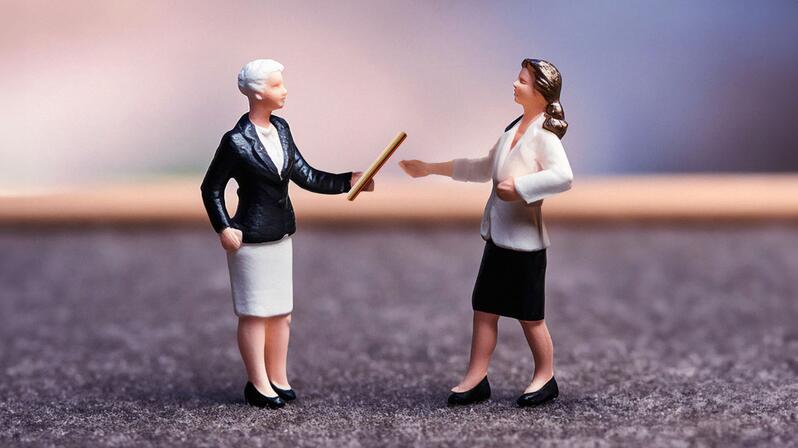 A company owner hands over the baton to her successor.
