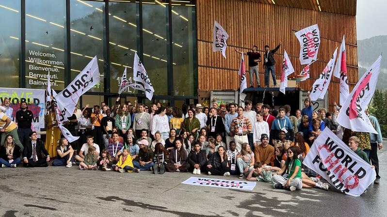 The photo shows the participants of the World Child Forum