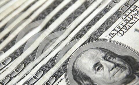 Interim financial management: The picture shows several 100-dollar bills that are slightly offset.